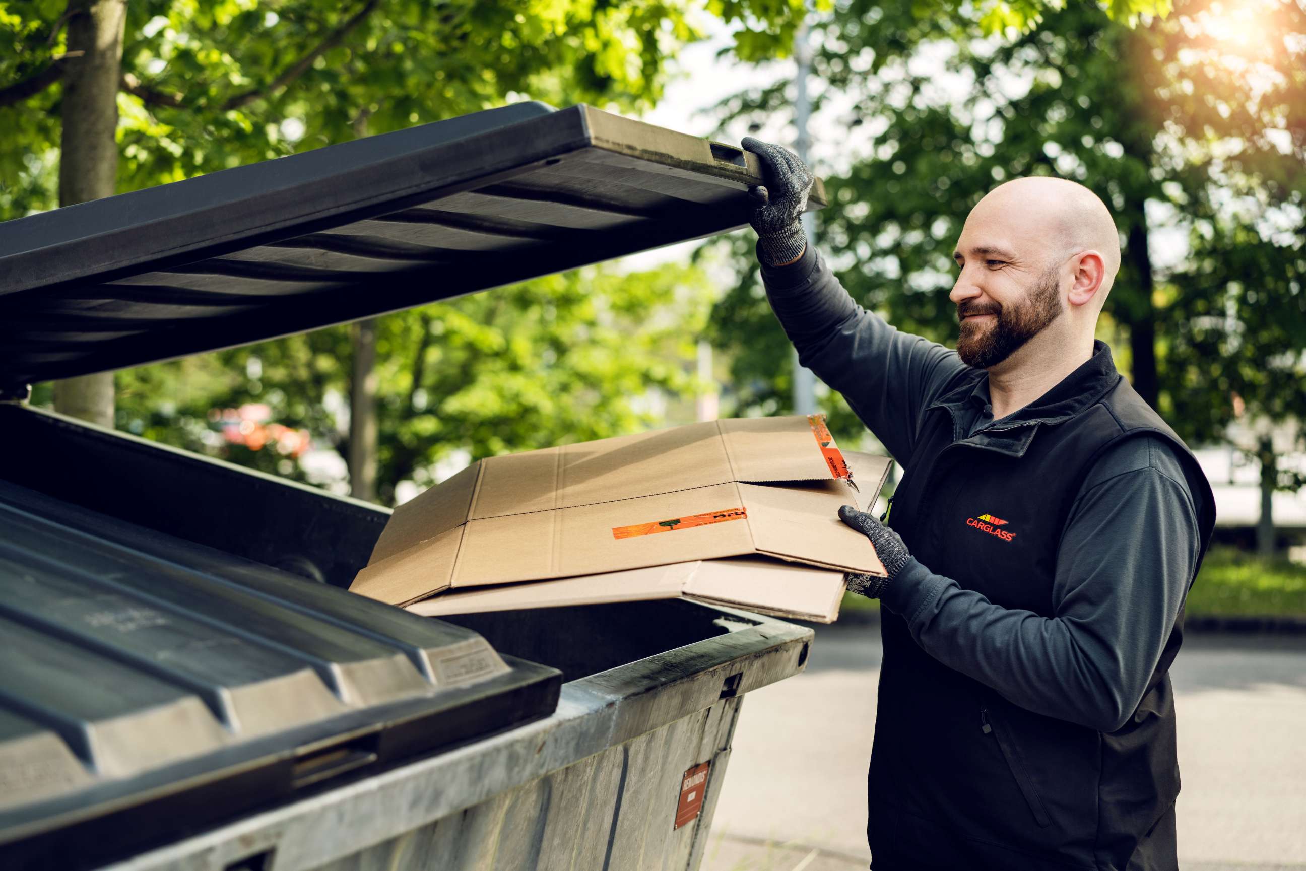 Man putting waste in bin